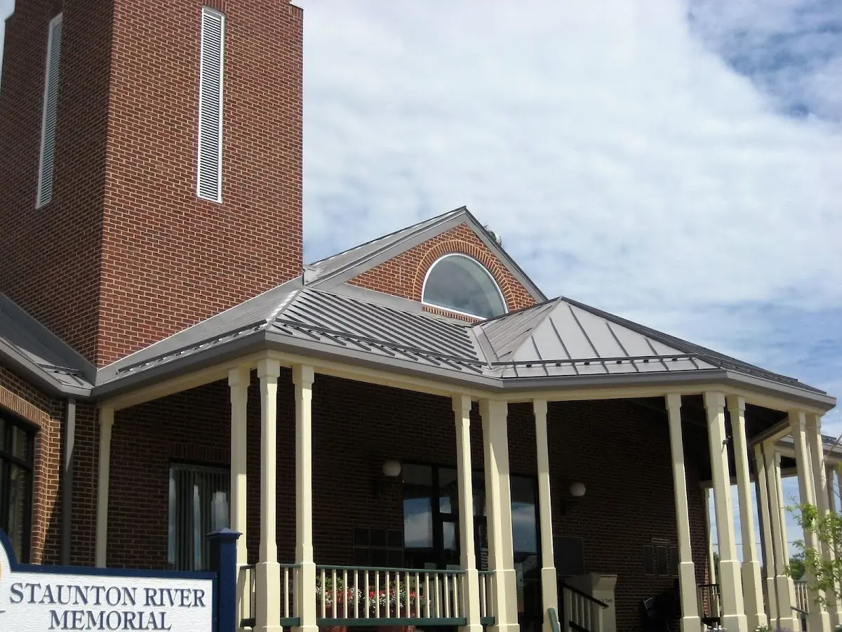 Skilled roofing craftsmen working on a residential roof in Streator